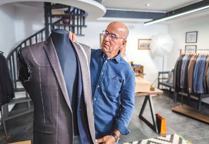 Custom Overcoats in Chicago A team member of Richard Bennett Custom Tailors is making a men's custom overcoat in Chicago, IL